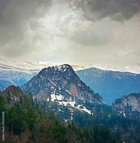 Fototapeta Naklejka Na Ścianę i Meble -  Springtime landscape of caucasus mountains with dramatic lighting