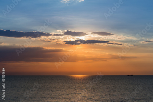 Beauty sunset over seacoast skyline, natural landscape background © pranodhm