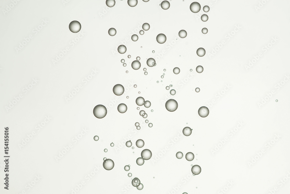 Beautiflul water bubbles is fllowing over a grey background Beautiflul water bubbles is fllowing over a grey background