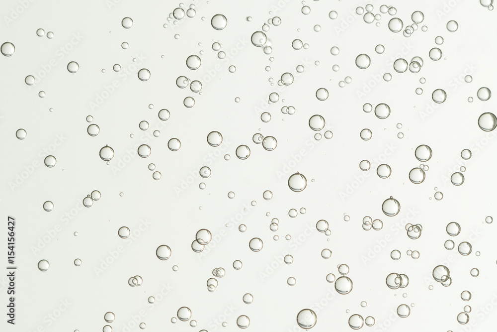Beautiful champagne bubbles soars over a  blurred background