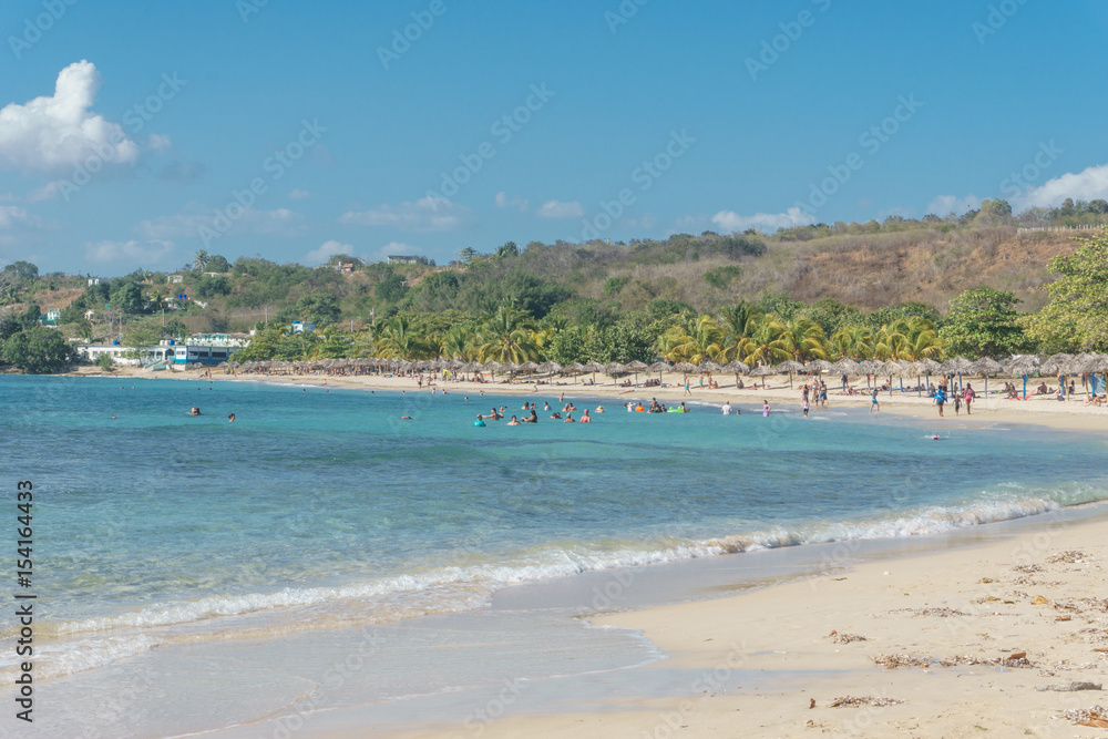 Cienfuegos, Cuba – January 1, 2017: Caribbean beach Playa Rancho Luna in Cienfuegos. Sandy coast