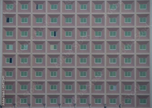 Fotografie crop of building with symetric green windows