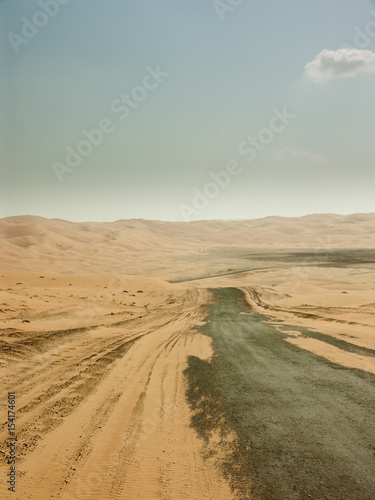 desert road disappearing in distance