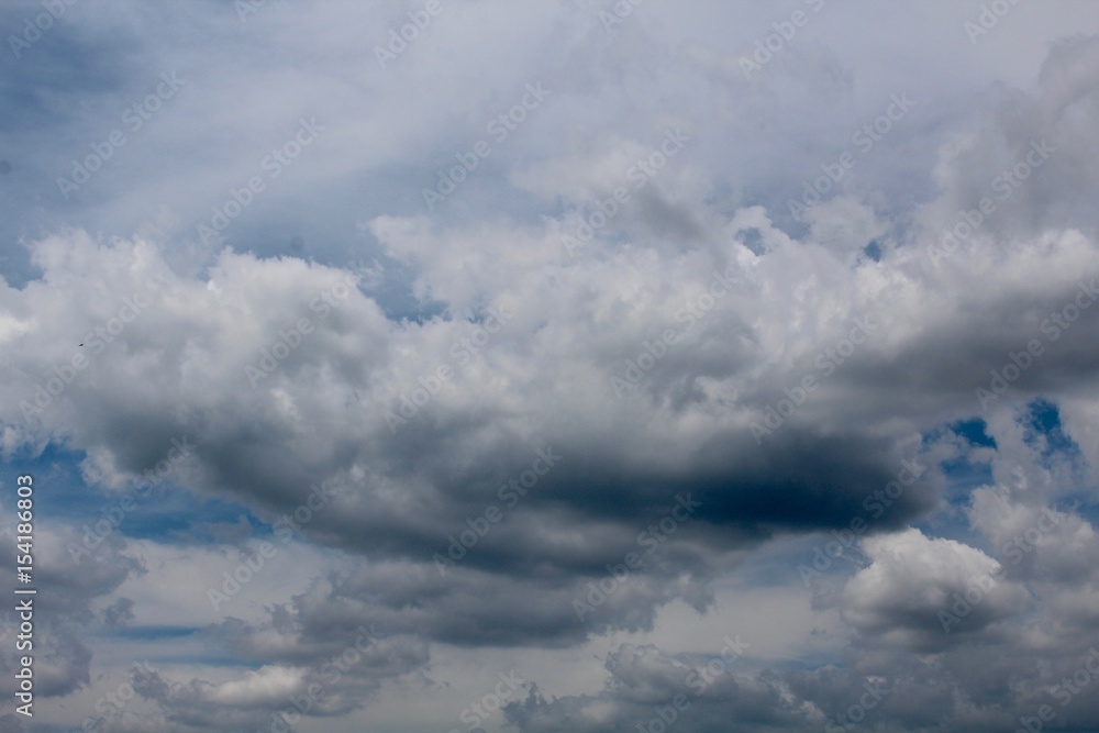 The mix of white and dark clouds in the sky. The mix of white and dark clouds in the sky.