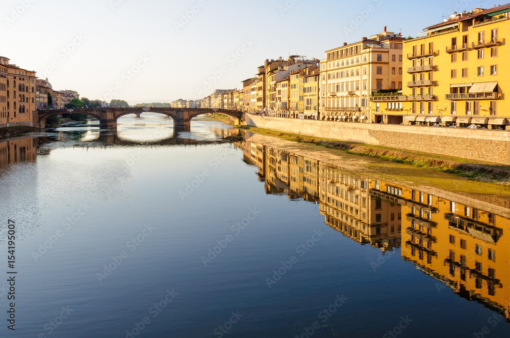 Santa Trinita bridge and Acciaiuoli embankment (lungarno) in the late afternoon sun - Florence, Tuscany, Italy