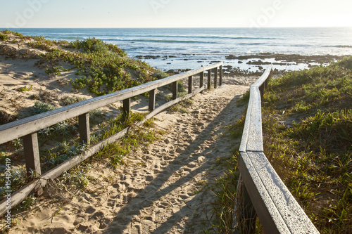 Fototapeta Naklejka Na Ścianę i Meble -  sandy walkway to a beach