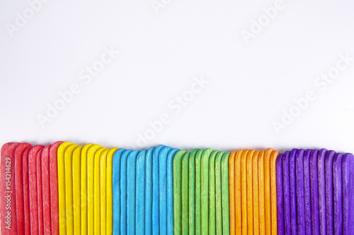 Colourful wooden sticks on white background © tuahlensa