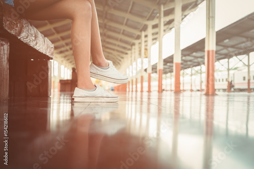 beautiful young asian girl traveling alone at train station  vintage tone 