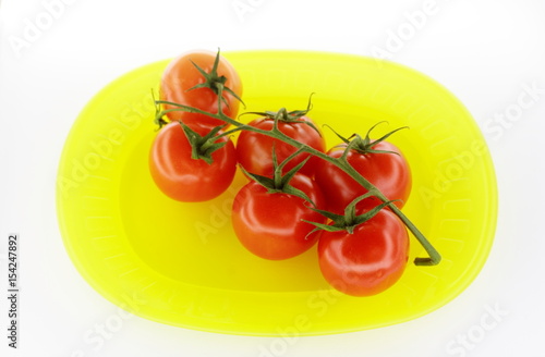 Tomatoes on yellow plate © georgeburba