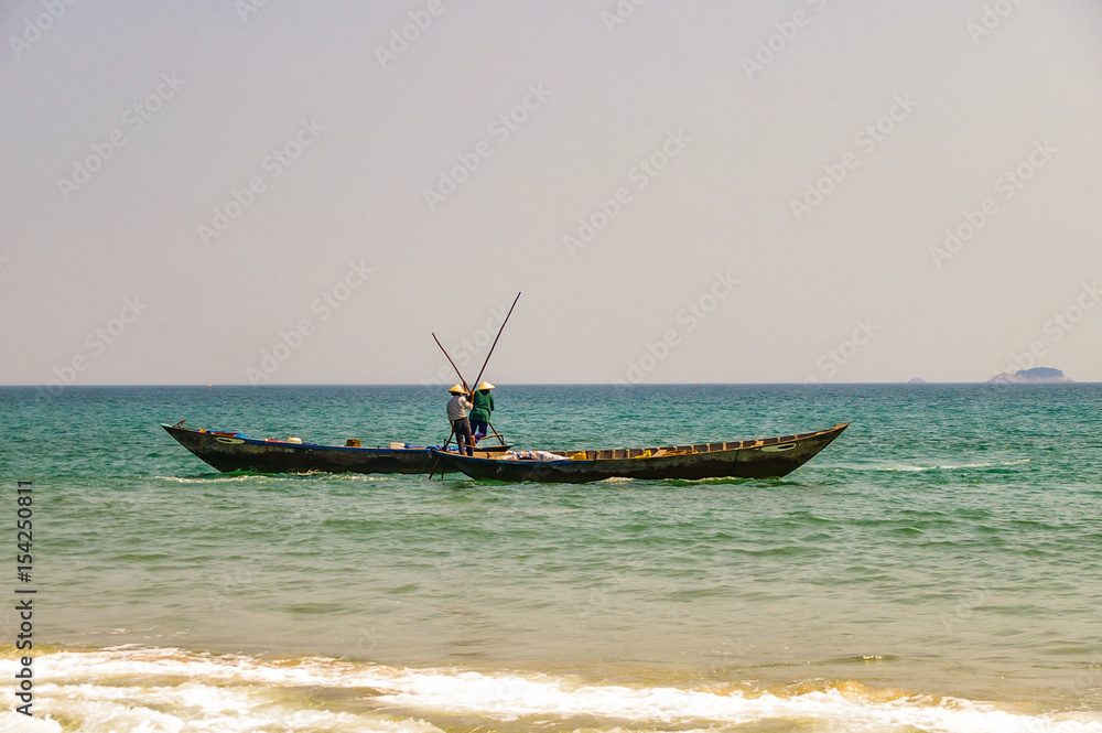 Traditional Vietnamese fishing along the beautiful coastline of Vietnam