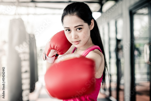 Woman boxing training in gym photo