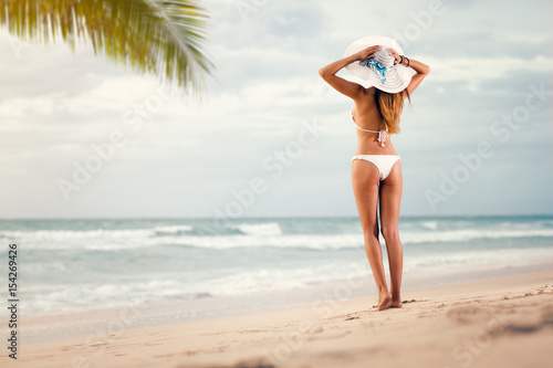 woman in sexy bikini looking in sea