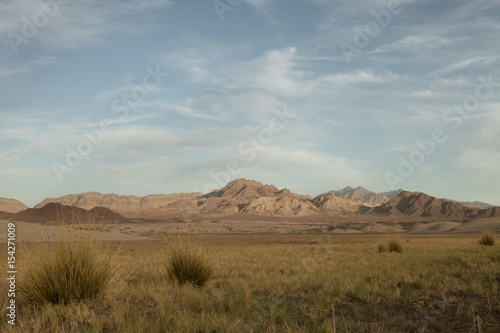 panoramic view death valley with some mountains on the back 