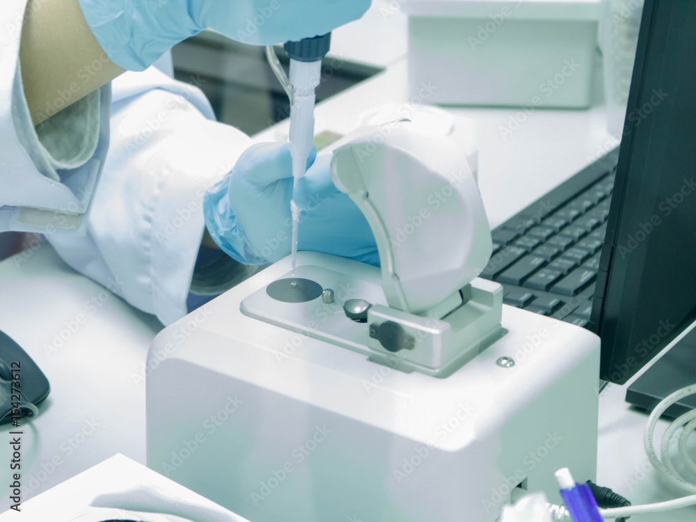 Scientist is experimenting in laboratory Scientist is experimenting in laboratory