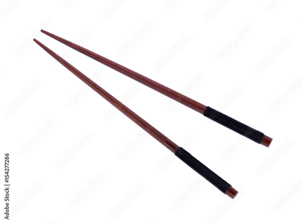 Wooden pairs of chopsticks on white background
