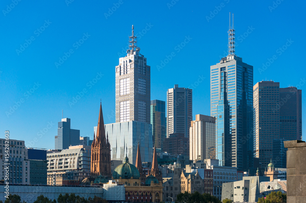 Melbourne CBD view wit Flinders station, St Paul's Cathedral and skyscrapers