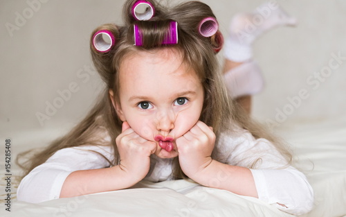 little girl face  curlers  close up