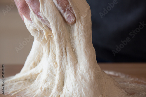 Kneading sourdough for rustic bread