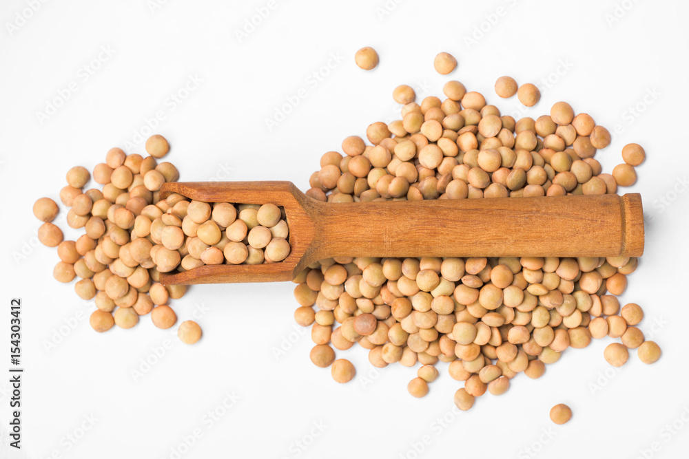 uncooked lentils on white, top view uncooked lentils on white, top view
