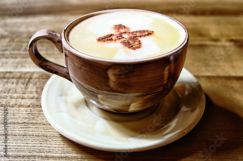 Fototapeta Naklejka Na Ścianę i Meble -  Brown coffee cup with flower pattern