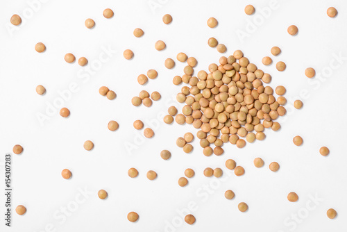 uncooked lentils on white, top view photo