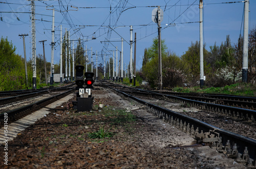 Red signal on a semaphore on railroad track