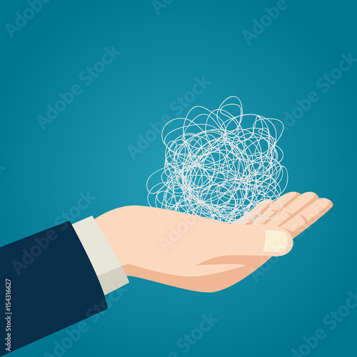 Hand holding tangled thread