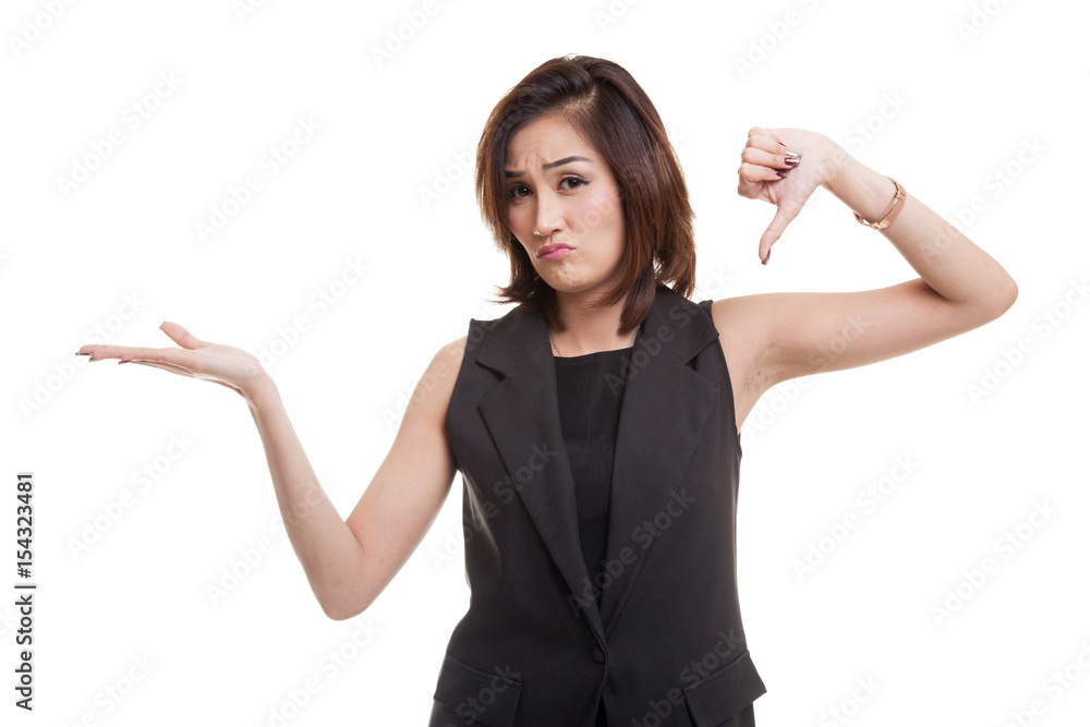 Young Asian woman show palm hand and thumbs down. Young Asian woman show palm hand and thumbs down.