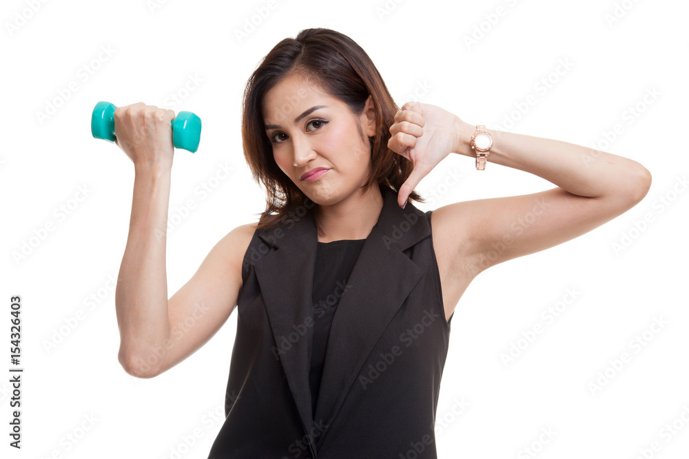 Unhappy Asian woman thumbs down with dumbbells. Unhappy Asian woman thumbs down with dumbbells.