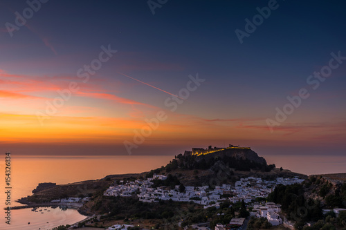 Beatiful sunrise on the island Rhodes. On the background the romantic place Lindos. Greece. Europe.