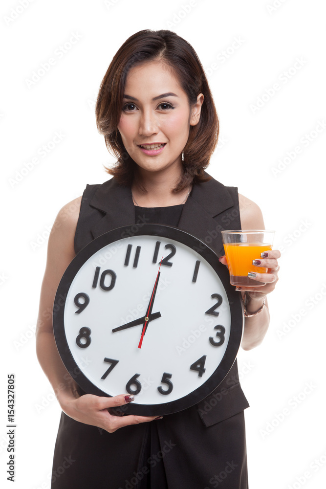 Asian woman with a clock drink orange juice. Asian woman with a clock drink orange juice.