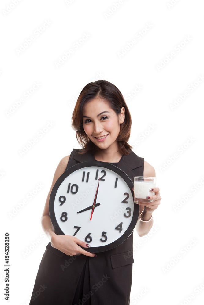 Healthy Asian woman drinking glass of milk hold clock. Healthy Asian woman drinking glass of milk hold clock.