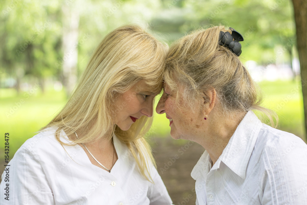 Mother and daughter in the park Mother and daughter in the park