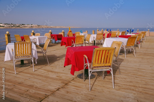 The sea view outdoor restaurant terrace with no people at the hotel  at Ramadan time  before sunset  Naama Bay  Sharm el Sheikh  Sinai  Egypt.