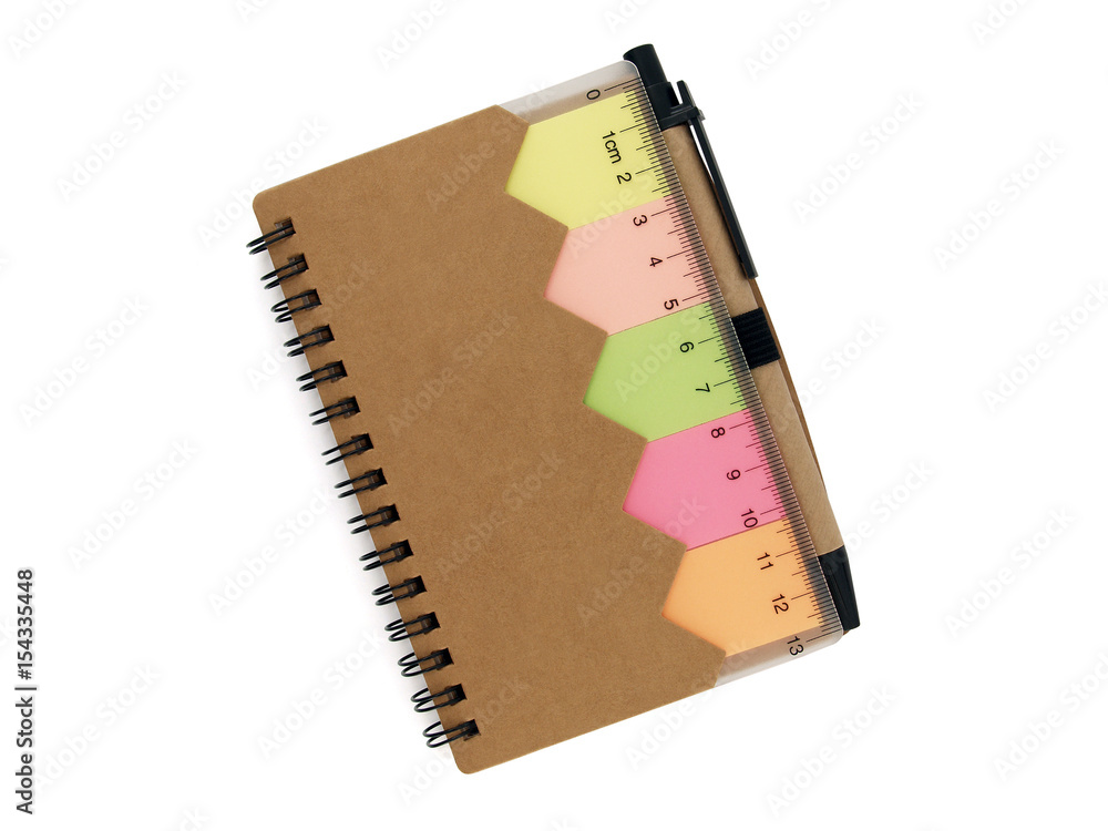 brown small recycled paper notebook isolated on white background, single  portable diary with colorful sticky notes, transparent plastic ruler and  ballpoint pen for writing note, flat lay top view Stock Photo