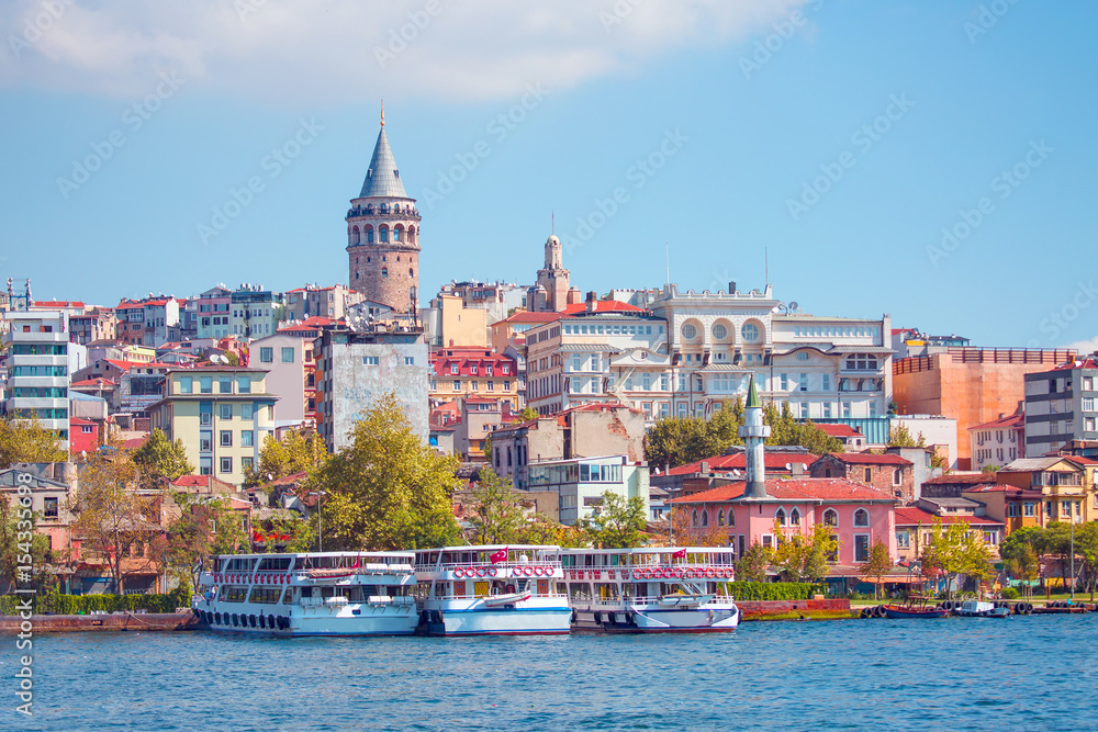 Obraz premium View of Galata district with Galata Tower over the Golden Horn in Istanbul, Turkey