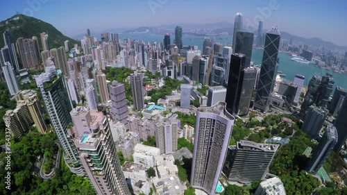 Hong Kong City Aerial. Beautiful Clear Blue Sky.
4K Aerial view capturing the general Hong Kong Island. Wide aerial forward shot flying over office buildings and skyscrapers.
