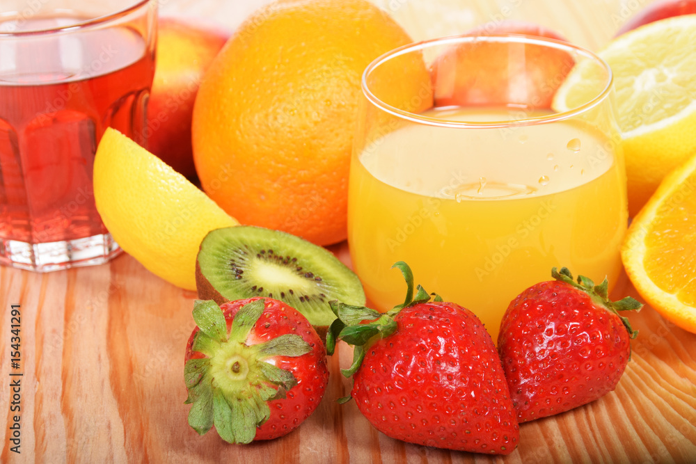 Orange juice in a glass with strawberries Orange juice in a glass with strawberries