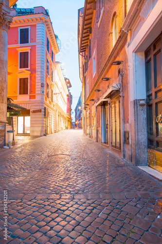 Old medieval street in the historic center of Rome at night. © muratart