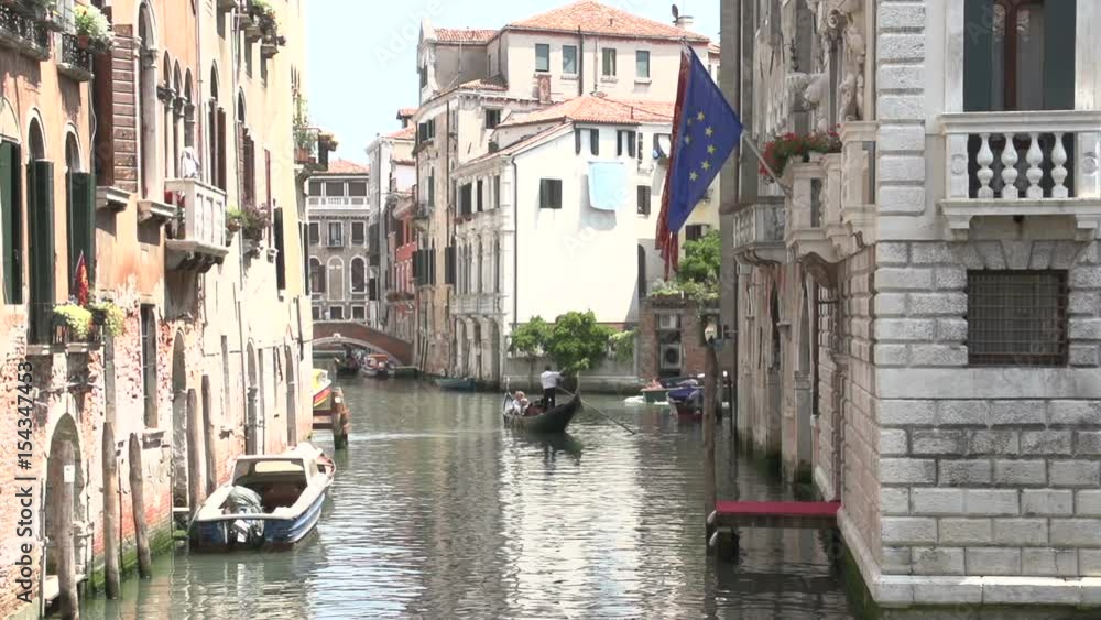 Gondolas in slow motion in a canal in Venice Italy Gondolas in slow motion in a canal in Venice Italy