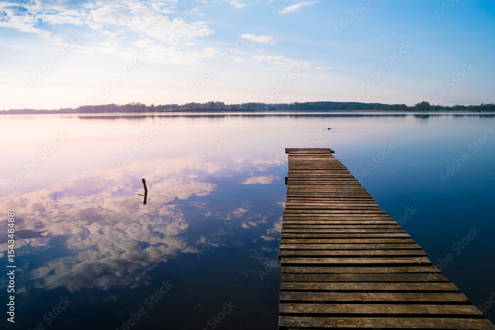 Obraz premium Empty footbridge over the lake Selment Wielki.