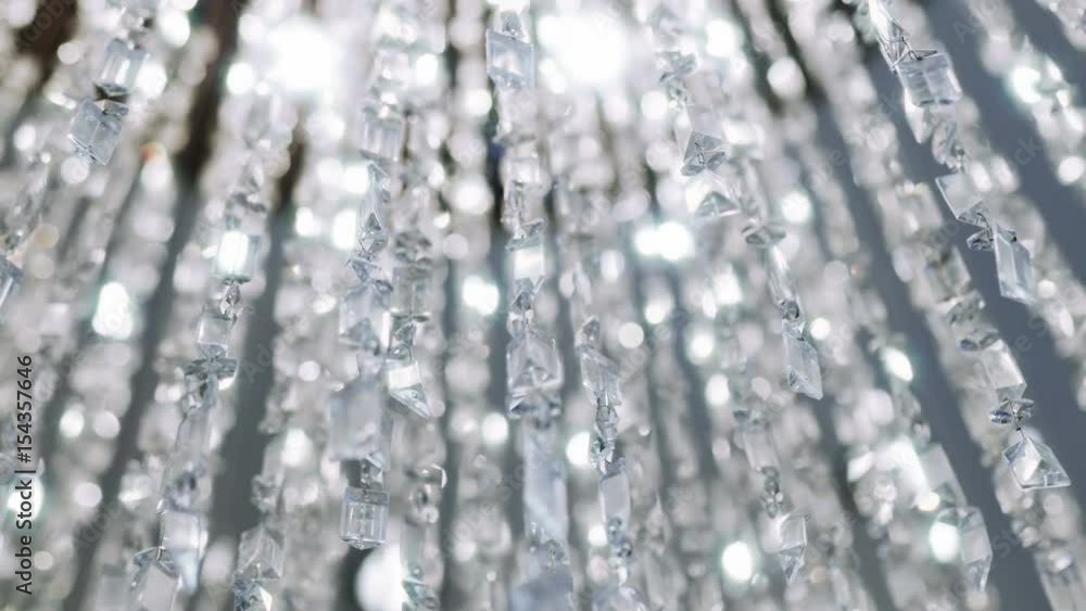 Crystal chandelier. Big classic crystals.
Low angle shot of a big beautiful crystal luxury chandelier. With bling bling shining reflection.
Crystal chandelier. Big classic crystals.
Low angle shot of a big beautiful crystal luxury chandelier. With bling bling shining reflection.