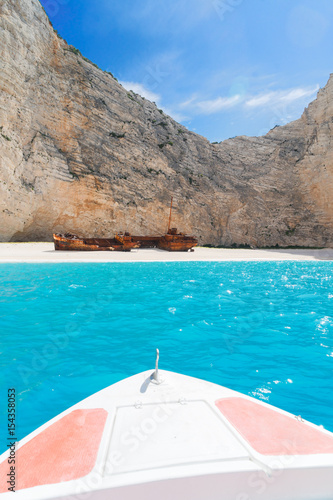 Navagio Shipwreak beach with rusty ship and boat, Beautiful landscape of Zakinthos island, Greece
