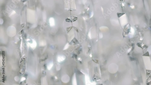 Crystal chandelier. Close up of the crystals. 
Close up shot of a big beautiful crystal luxury chandelier. With bling bling shining reflection.
