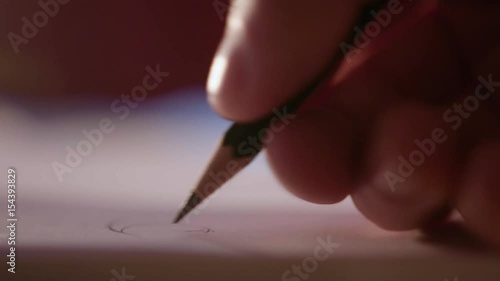 Artist Drawing Picture with Pencil - Close Up photo