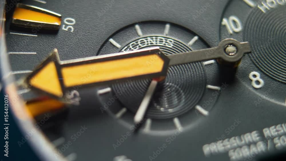 Time Flies. Diving Deep Sea Watch Close Up 4K Timelapse.
Time is running out. Close-up of watch with orange clock hands moving.