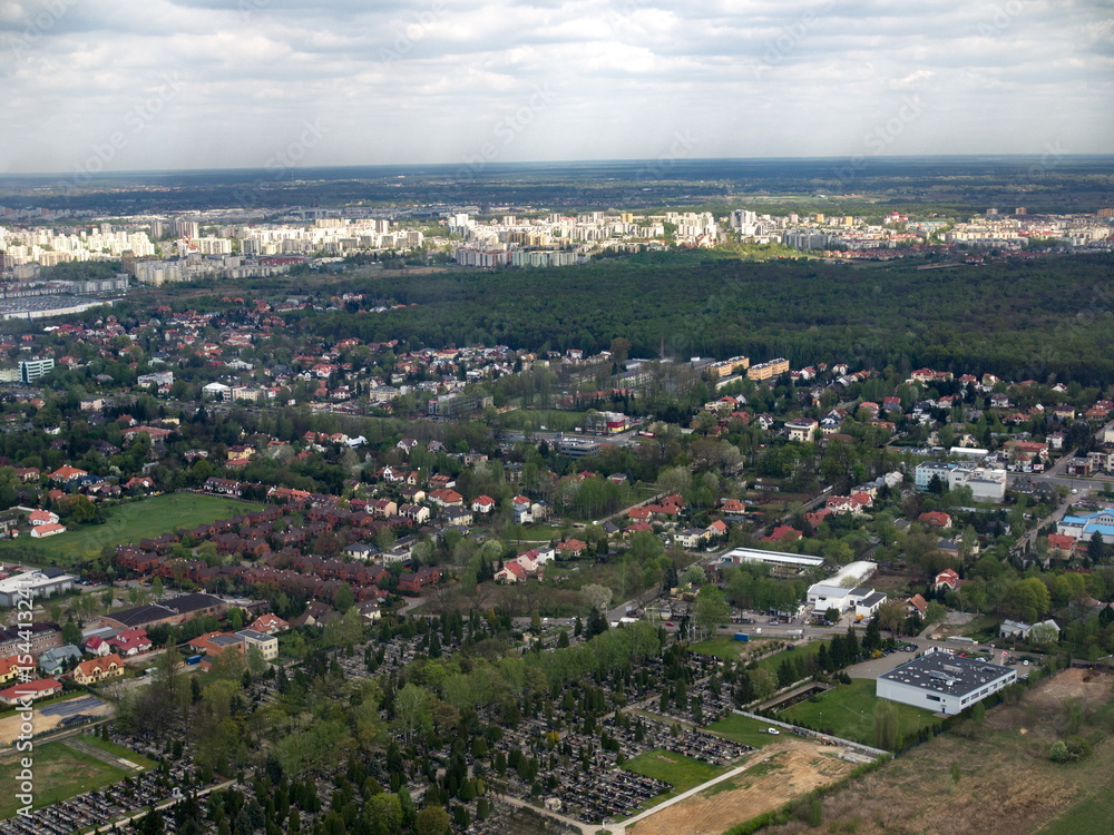Aerial cityscape graveyard forest and buildings Aerial cityscape graveyard forest and buildings