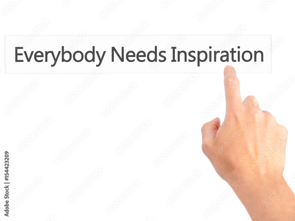 Everybody Needs Inspiration - Hand pressing a button on blurred background concept on visual screen. Everybody Needs Inspiration - Hand pressing a button on blurred background concept on visual screen.