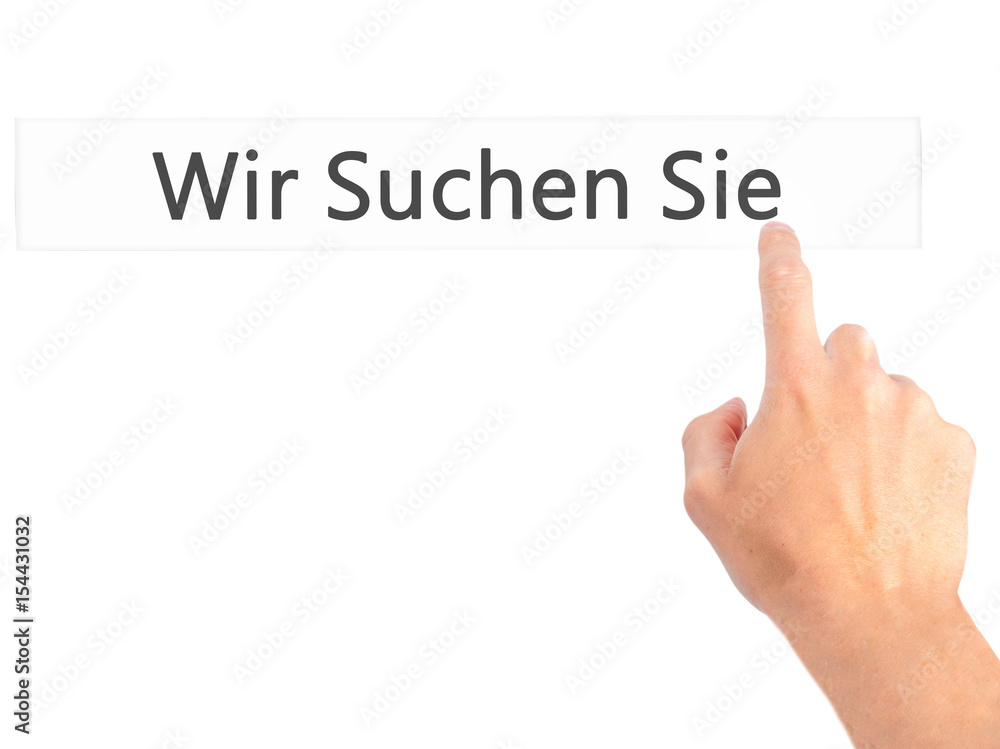Wir Suchen Sie! (Looking For You in German) - Hand pressing a button on blurred background concept on visual screen. Wir Suchen Sie! (Looking For You in German) - Hand pressing a button on blurred background concept on visual screen.