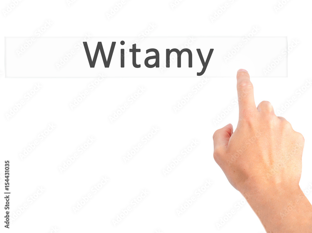 Witamy - Hand pressing a button on blurred background concept on visual screen. Witamy - Hand pressing a button on blurred background concept on visual screen.